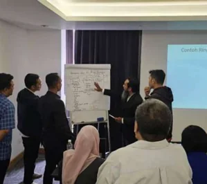 Banking professionals participating in a practical AI workshop
